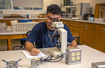 student in biology lab