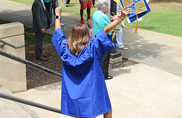 graduate celebrating