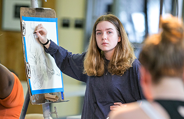 student in painting class