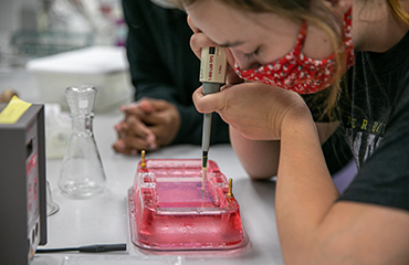 student in biology lab