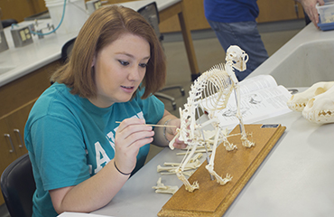 student in biology lab